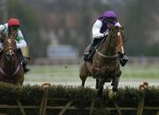 26 December 2005; Finger On The Pulse, with Shane McGovern up, on their way to winning The Durkan New Homes Maiden Hurdle ahead of Akarem, with Niall Madden, left, who finished second. Leopardstown Racecourse, Co. Dublin. Picture credit: Pat Murphy / SPORTSFILE