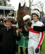 27 December 2005; Jockey Andrew McNamara with his mount Hi Cloy celebrate with trainer Michael Hourigan after winning the Paddy Power Dial-a-Bet Steeplechase. Leopardstown Racecourse, Co. Dublin. Picture credit: David Maher / SPORTSFILE