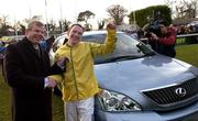 28 December 2005; Jockey Paul Carberry is presented with the keys of a Lexus by the Managing Director of Lexus, Mark Teevan, which he won for a year after winning the Lexus Steeplechase. Leopardstown Racecourse, Co. Dublin. Picture credit: Matt Browne / SPORTSFILE