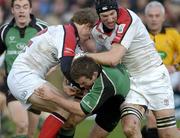 31 December 2005; John Fogarty, Connacht, is tackled by Andrew Trimble, 12, and Justin Harrison, Ulster. Celtic League 2005-2006, Group A, Connacht v Ulster, Sportsground, Galway. Picture credit: Ray McManus / SPORTSFILE