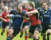 31 December 2005; Will Green, Leinster, is tackled by Jerry Flannery, Munster. Celtic League 2005-2006, Group A, Leinster v Munster, RDS, Dublin. Picture credit: Matt Browne / SPORTSFILE