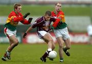 8 January 2006; Alan Mangan, Westmeath, is tackled by John Keogh, right, and Trevor Smith, Carlow. O'Byrne Cup, First Round, Carlow v Westmeath, Dr. Cullen Park, Carlow. Picture credit: Matt Browne / SPORTSFILE
