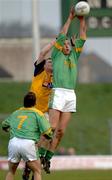 8 January 2006; Anthony Moyles, Meath, wins possession from Eoin Lennon, D.C.U. as Seamus Kenny awaits the dropping ball. O'Byrne Cup, First Round, Meath v DCU, Pairc Tailteann, Navan, Co. Meath. Picture credit: Ray McManus / SPORTSFILE