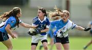 12 April 2014; Helena Walsh, Colaiste Dun lascaigh, in action against Megan McClelland, left, and Shannon Monaghan, St. Ciaran's. Tesco HomeGrown Post Primary School Junior A, St Ciaran's, Ballygawley, Co. Tyrone v Colaiste Dun lascaigh, Cahir, Co. Tipperary. Cusack Park, Mullingar, Co. Westmeath. Photo by Sportsfile