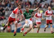 13 April 2014; Keith Higgins scores Mayo's 4th point in the 12th minute under pressure from Gerard O'Kane of Derry. Allianz Football League Division 1 Semi-Final, Derry v Mayo, Croke Park, Dublin. Picture credit: Ray McManus / SPORTSFILE