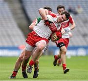 13 April 2014; Mark Lynch, Derry, is tackled by Mayo corner back Brendan Harrison. Allianz Football League Division 1 Semi-Final, Derry v Mayo, Croke Park, Dublin. Picture credit: Ray McManus / SPORTSFILE