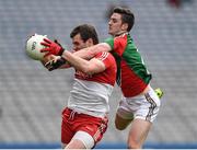 13 April 2014; Mark Lynch, Derry, is tackled by Mayo corner back Brendan Harrison. Allianz Football League Division 1 Semi-Final, Derry v Mayo, Croke Park, Dublin. Picture credit: Ray McManus / SPORTSFILE