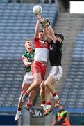 13 April 2014; Emmett McGuickin, Derry, in action against the Mayo goalkeeper Robert Hennelly, right, and Kevin Keane. Allianz Football League Division 1 Semi-Final, Derry v Mayo, Croke Park, Dublin. Picture credit: Ray McManus / SPORTSFILE