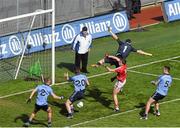 13 April 2014; Mark Collins, Cork, beats Dublin goalkeeper Stephen Cluxton and Dublin players, left to right, Jonny Cooper, Nicky Devereux and James McCarthy to score their side's second goal. Allianz Football League Division 1 Semi-Final, Cork v Dublin, Croke Park, Dublin. Picture credit: Ray McManus / SPORTSFILE