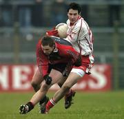 8 January 2006; Colm Donnelly, Tyrone, in action against Brendan Kearney, Down. Dr. McKenna Cup, First Round, Tyrone v Down, Healy Park, Omagh, Co. Tyrone. Picture credit: Pat Murphy / SPORTSFILE