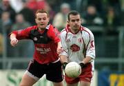 8 January 2006; Adrian Ball, Tyrone, in action against Liam Doyle, Down. McKenna Cup, First Round, Tyrone v Down, Healy Park, Omagh, Co. Tyrone. Picture credit: Pat Murphy / SPORTSFILE