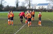 7 January 2006; The referee checks the players boots before the game. Tipperary U11 Soccer League, Clerihan v Clonmel Town, Clerihan Soccer Pitch, Co. Tipperary. Picture credit; Ray McManus/ SPORTSFILE