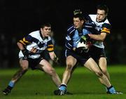 11 January 2006; Denis Bastick, Dublin, is tackled by James Sherry, right, and Ken Doherty, UCD. O'Byrne Cup, First Round, Dublin v UCD, O'Toole's GAA Club, Ayrefield Park, Coolock, Dublin. Picture credit: Matt Browne / SPORTSFILE