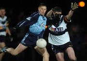 11 January 2006; Donnacha Reilly, Dublin, is tackled by Ken Doherty, UCD. O'Byrne Cup, First Round, Dublin v UCD, O'Toole's GAA Club, Ayrefield Park, Coolock, Dublin. Picture credit: David Levingstone / SPORTSFILE