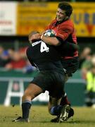 13 January 2006; Marcus Horan, Munster, is tackled by Karim Ghezal, Castres Olympique. Heineken Cup 2005-2006, Pool 1, Round 5, Castres Olympique v Munster, Stade Pierre Antoine, Castres, France. Picture credit: Brendan Moran / SPORTSFILE