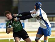 14 January 2006; Chris Keane, Connacht, is tackled by Mickael Bert, Montpellier. European Challenge Cup, Pool 5, Connacht v Montpellier, Sportsground, Galway. Picture credit: Damien Eagers / SPORTSFILE