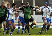 14 January 2006; John Muldoon, Connacht, is tackled by Regis Lespinas, left and Mickael Bert, Montpellier. European Challenge Cup, Pool 5, Connacht v Montpellier, Sportsground, Galway. Picture credit: Damien Eagers / SPORTSFILE