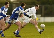 15 January 2006; John Divilly, Kildare, in action against Derek Conroy and Shane Cooke, left, Laois. O'Byrne Cup, Second Round, Kildare v Laois, St. Conleth's Park, Newbridge, Co. Kildare. Picture credit: Pat Murphy / SPORTSFILE