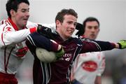 15 January 2006; Colm Donnelly, Tyrone, is tackled by James Lavery, St. Mary's College Belfast. Dr McKenna Cup, Tyrone v St. Mary's College Belfast. Coalisland, Co. Tyrone. Picture credit: Oliver McVeigh / SPORTSFILE