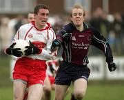 15 January 2006; Tommy McGuigan, Tyrone, is tackled by Martin Murray, St. Mary's College Belfast. Dr McKenna Cup, Tyrone v St. Mary's College Belfast. Coalisland, Co. Tyrone. Picture credit: Oliver McVeigh / SPORTSFILE
