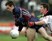 15 January 2006; Dan Gordon, St. Mary's College Belfast, is tackled by Shane Sweeney, Tyrone. Dr McKenna Cup, Tyrone v St. Mary's College Belfast. Coalisland, Co. Tyrone. Picture credit: Oliver McVeigh / SPORTSFILE