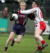 15 January 2006; Martin Murray, St. Mary's College Belfast, is tackled by Colin Holmes, Tyrone. Dr McKenna Cup, Tyrone v St. Mary's College Belfast. Coalisland, Co. Tyrone. Picture credit: Oliver McVeigh / SPORTSFILE