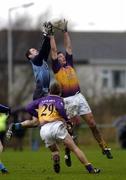 15 January 2006; Denis Bastick, Dublin, in action against David Fogarty, Wexford, as Redmond Barry awaits the breaking ball. O'Byrne Cup, Second Round, Dublin v Wexford, O'Toole's GAA Club, Ayrefield Park, Coolock, Dublin. Picture credit: Brian Lawless / SPORTSFILE