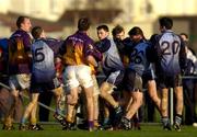 15 January 2006; Dublin and Wexford players become involved in a tussle during the match. O'Byrne Cup, Second Round, Dublin v Wexford, O'Toole's GAA Club, Ayrefield Park, Coolock, Dublin. Picture credit: Brian Lawless / SPORTSFILE