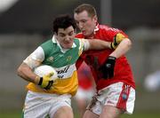 15 January 2006; John Reynolds, Offaly, in action against Christy Grimes, Louth. O'Byrne Cup, Second Round, Louth v Offaly, Clanna Gael Park, Dundalk, Co. Louth. Picture credit: Ray McManus / SPORTSFILE