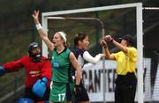 15 January 2006; Nikki Symmons, Ireland, celebrate after scoring a goal while Scotland's Jane Burley protests with the umpire. The goal was disallowed. ESB International Hockey 2nd Test, Ireland v Scotland, UCD, Belfield, Dublin. Picture credit; David  Levingstone/ SPORTSFILE