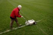 15 January 2006; Groundsman Pat Kelly paints the white lines before the game. O'Byrne Cup, Second Round, Louth v Offaly, Clanna Gael Park, Dundalk, Co. Louth. Picture credit: Ray McManus / SPORTSFILE