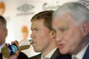 16 January 2006; Steve Staunton has a drink as he listens to Sir Bobby Robson, International football consultant during a FAI press conference to confirm his appointment as the new Manager of the Republic of Ireland Senior International Soccer Team. Mansion House, Dublin. Picture credit: Damien Eagers / SPORTSFILE