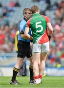13 April 2014; Referee Pádraig Hughes, in conversation with Lee Keegan, Mayo, after showing him a yellow card. Allianz Football League Division 1 Semi-Final, Derry v Mayo, Croke Park, Dublin. Picture credit: Piaras Ó Mídheach / SPORTSFILE