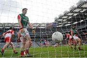 13 April 2014; Kevin Johnston, No. 5, Derry, turns to celebrate after scoring his side's second goal as Brendan Harrison, left, and Shane McHale, Mayo, look on. Allianz Football League Division 1 Semi-Final, Derry v Mayo, Croke Park, Dublin. Picture credit: David Maher / SPORTSFILE