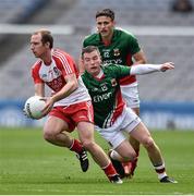 13 April 2014; Sean Leo McGoldrick, Derry, in action against Mickey Sweeney and Jason Doherty, Mayo. Allianz Football League Division 1 Semi-Final, Derry v Mayo, Croke Park, Dublin. Picture credit: David Maher / SPORTSFILE
