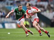 13 April 2014; Sean Leo McGoldrick, Derry, in action against Keith Higgins, Mayo. Allianz Football League Division 1 Semi-Final, Derry v Mayo, Croke Park, Dublin. Picture credit: David Maher / SPORTSFILE