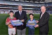 13 April 2014; Donal Bollard, from Allianz, and Brendan Murphy, Cumann na mBunscoil Chairman, make a special presentation to Tom Geary, Scoil Assaim, Raheny, and Cathal O'Grady, St Brigid's, Killester, in Croke Park to mark their outstanding performance during the Allianz Cumann na mBunscol competitions. Picture credit: Ray McManus / SPORTSFILE