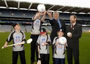 16 January 2006; Sean Kelly, President, GAA, and Vincent Sheridan, Chief Executive, Vhi Healthcare, with Karl Wolfe, 9, Kilmacud Crokes, twelve year old Michael McLoughlin, Father Manning Gales, Aoife Wade, 8, Whitehall Colmcilles, and Aisling Bergin, 9, Na Fianna, at the announcement of a new summer camp initiative, Vhi Cul Camps, which will see an estimated 80,000 children receive hurling, Camogie and Gaelic Football coaching at GAA run camps every summer. Croke Park, Dublin. Picture credit; Ray McManus / SPORTSFILE