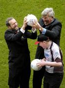 16 January 2006; Sean Kelly, President, GAA, and Vincent Sheridan, Chief Executive, Vhi Healthcare, with twelve year old Michael McLoughlin, Father Manning Gales, Longford, at the announcement of a new summer camp initiative, Vhi Cul Camps, which will see an estimated 80,000 children receive hurling, Camogie and Gaelic Football coaching at GAA run camps every summer. Croke Park, Dublin. Picture credit; Pat Murphy / SPORTSFILE