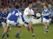 15 January 2006; Padraig O'Neill, Kildare, in action against Brian McCormack and Derek Conroy, 6, Laois. O'Byrne Cup, Second Round, Kildare v Laois, St. Conleth's Park, Newbridge, Co. Kildare. Picture credit: Ciara Lyster / SPORTSFILE