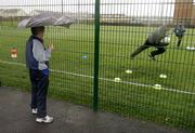 15 January 2006; Young goalkeeper Daniel Monaghan, age 10, from Coolock, watches the Dublin goalkeepers warm up before the match. O'Byrne Cup, Second Round, Dublin v Wexford, O'Toole's GAA Club, Ayrefield Park, Coolock, Dublin. Picture credit: Brian Lawless / SPORTSFILE