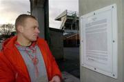 17 January 2006; Gintaras Vaivada, from Lithuania, reads a site notice outside Lansdowne Road Stadium outlining the planning application as made by Lansdowne Road Stadium Development Company Limited. In a joint statement, the GAA, the IRFU and the FAI confirmed that agreement has been reached for the use of Croke Park for Rugby and Soccer International matches in 2007. Croke Park, Dublin. Picture credit; Brian Lawless / SPORTSFILE