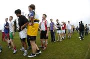 18 January 2006; Competitors line up in order at the finish of the Senior Boys race. DCU Secondary Schools Invitational Cross Country Meet, St. Clare's Sportsgrounds, DCU, Dublin. Picture credit; Brian Lawless / SPORTSFILE