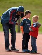15 April 2014; Munster's Simon Zebo signs autographs for Alex Odell, aged 7, left, and Rory Odell, aged 5, from Dromcollogher, Co. Limerick, as he sits out squad training ahead of their side's Celtic League 2013/14 Round 20 match against Connacht on Saturday. Munster Rugby Squad Training, University of Limerick, Limerick. Picture credit: Diarmuid Greene / SPORTSFILE