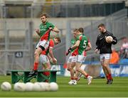 13 April 2014; Jason Gibbons, Mayo, jumps over the bench before the team photograph. Allianz Football League Division 1 Semi-Final, Derry v Mayo, Croke Park, Dublin. Picture credit: Piaras Ó Mídheach / SPORTSFILE