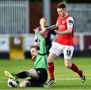 18 April 2014; Lee Lynch, St Patrick's Athletic, in action against Ryan McEvoy, Bohemians. Airtricity League Premier Division, St Patrick's Athletic v Bohemians, Richmond Park, Dublin. Picture credit: David Maher / SPORTSFILE