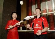 19 January 2006; Amy Teo, Guest Services Manager, Marina Mandarin Hotel, with Niall Gilligan, Clare, as the 2006 Vodafone All-Stars Hurling Tour teams arrive. Marina Mandarina Hotel, Marina Square, Singapore. Picture credit; Ray McManus / SPORTSFILE