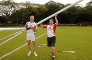20 January 2006; Clare players Tony Carmody and David Fitzgerald lend a hand in erecting the goal posts before training in advance of the 2006 Vodafone All-Stars Hurling game. Singapore Polo Club, Singapore. Picture credit; Ray McManus / SPORTSFILE