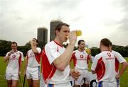 20 January 2006; Ollie Moran enjoys a drink after training in advance of the 2006 Vodafone All-Stars Hurling game. Singapore Polo Club, Singapore. Picture credit; Ray McManus / SPORTSFILE