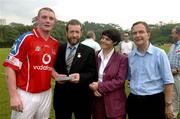 21 January 2006; Eamon Corcoran,Tipperary, who played on the 2004 Vodafone All-Stars team, is presented with a commerative medal by GAA President Sean Kelly in the company of Helen Marks, Head of Brand and Marcomms, Vodafone Ireland and Minister for Transport Martin Cullen, T.D., after the game. Exhibition Game, 2004 Vodafone All-Stars v 2005 Vodafone All-Stars, Singapore Polo Club, Singapore. Picture credit; Ray McManus / SPORTSFILE